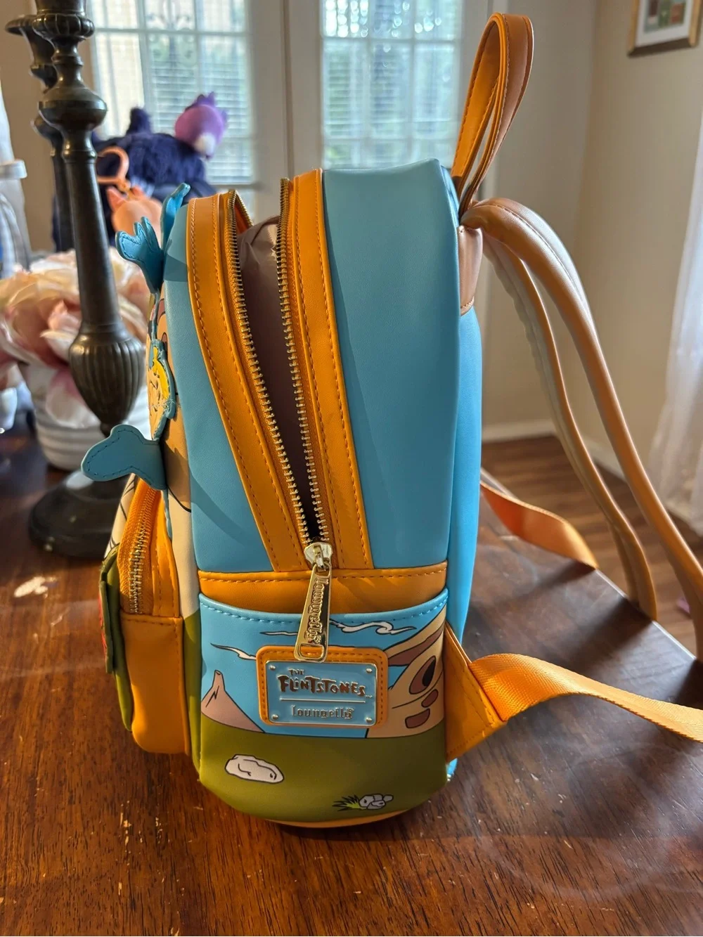 Cartoon Flintstones Loungefly Mini Backpack in Light Blue and Yellow